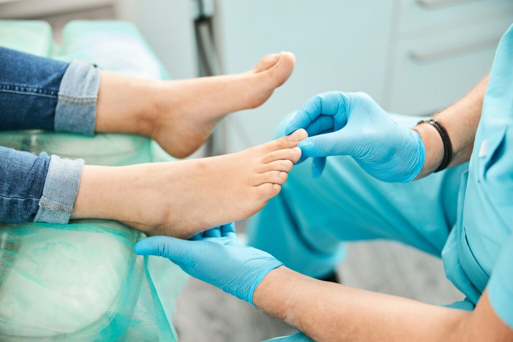 podiatrist checking the patient's toe